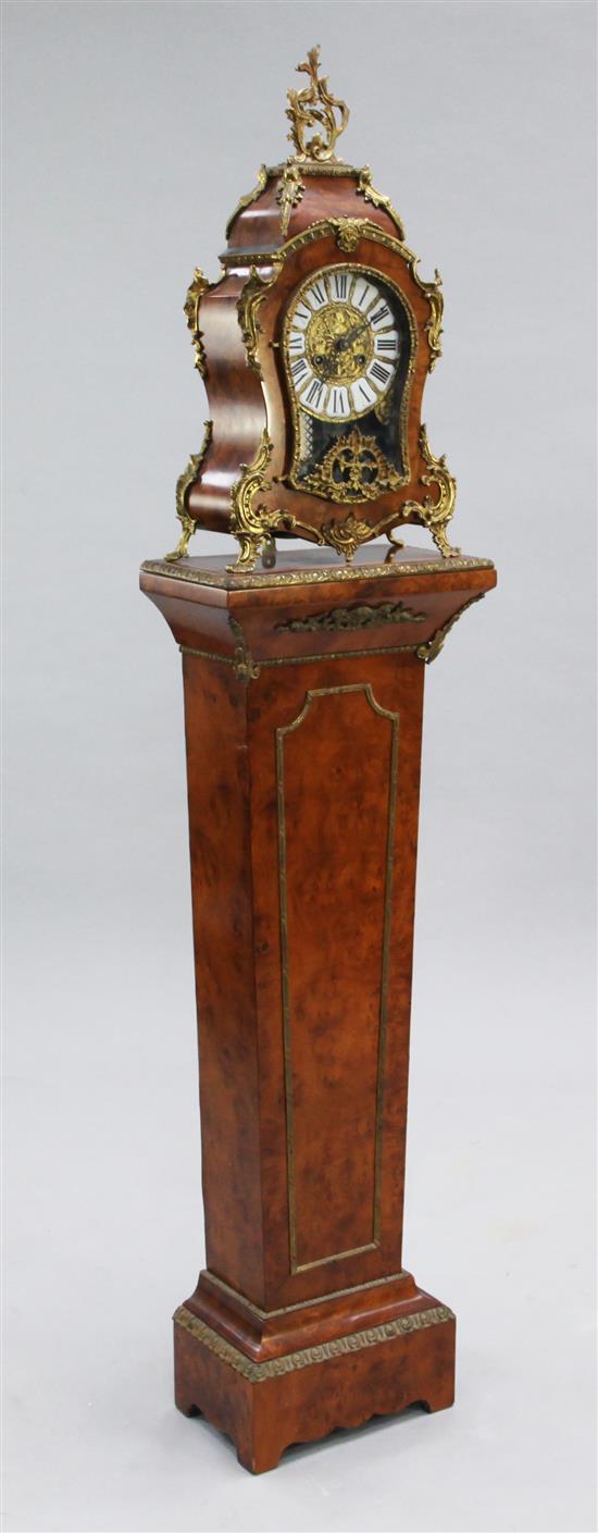 A Louis XVI style ormolu mounted burr wood mantel clock and pedestal, overall height 5ft 4in.